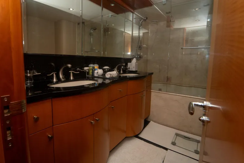 Living The Dream Yacht Photos Pics Luxurious bathroom in 2008 Lazzara 84 Open Bridge yacht with elegant wood cabinetry.