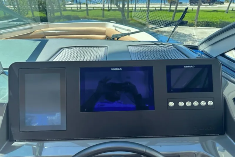  Yacht Photos Pics 2022 Aviara AV32 Outboard dashboard with Simrad displays and controls.