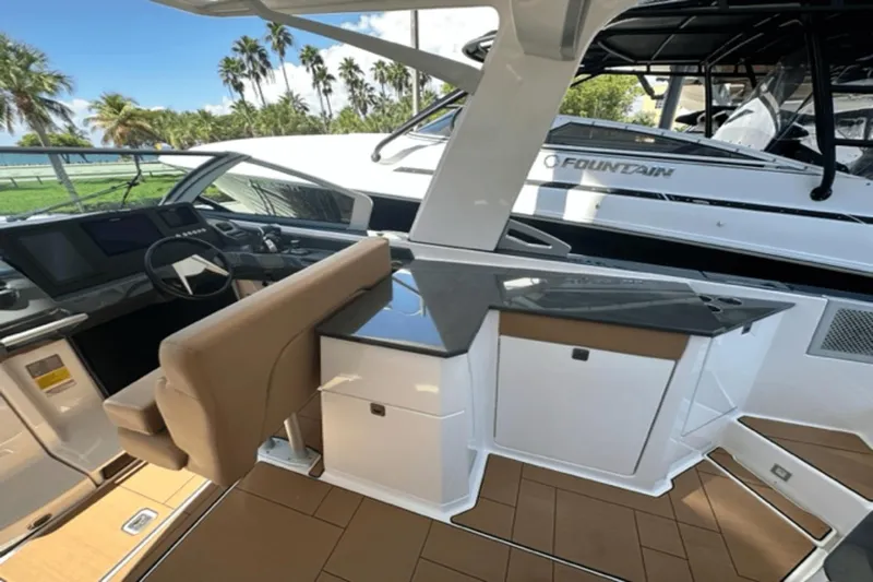  Yacht Photos Pics 2022 Aviara AV32 Outboard interior with helm, seating, and sleek design.