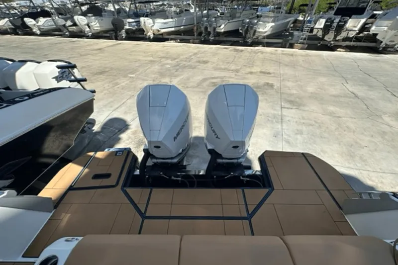  Yacht Photos Pics 2022 Aviara AV32 Outboard with twin Mercury engines at a marina.