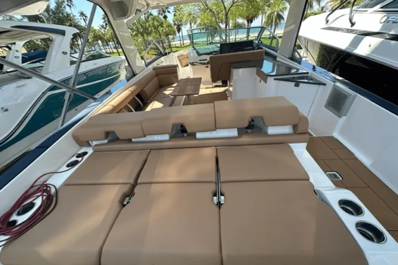  Yacht Photos Pics 2022 Aviara AV32 Outboard boat interior with tan seating and modern design.