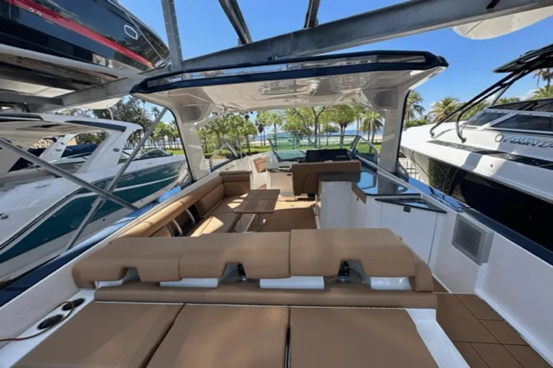  Yacht Photos Pics 2022 Aviara AV32 Outboard luxury boat interior with tan seating and sleek design.