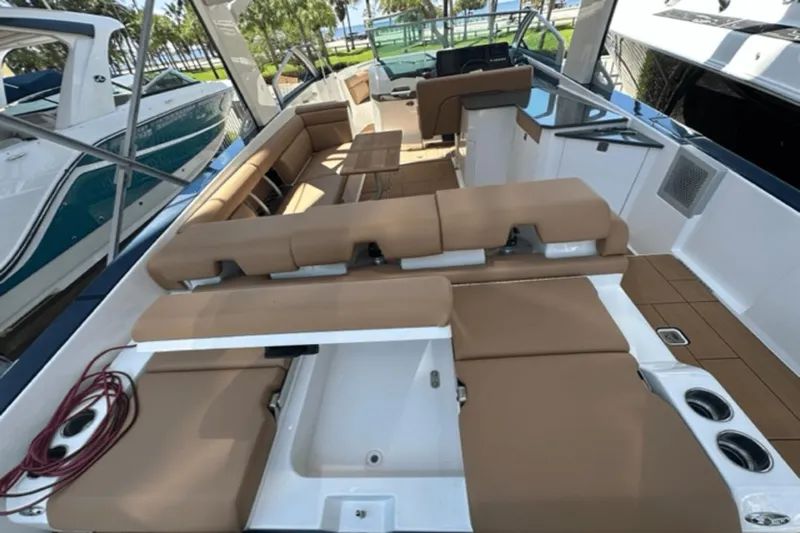  Yacht Photos Pics 2022 Aviara AV32 Outboard boat interior with tan seating and modern design.