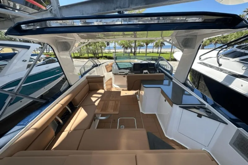  Yacht Photos Pics 2022 Aviara AV32 Outboard luxury boat interior with seating and table.