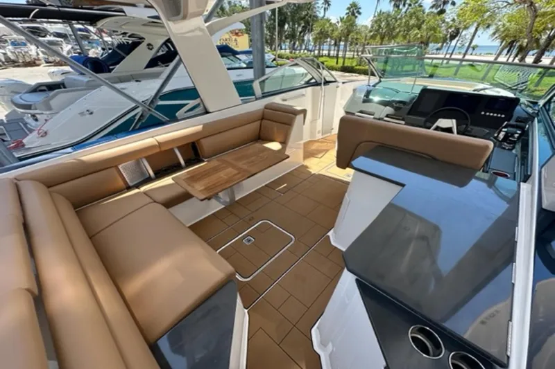  Yacht Photos Pics Luxurious 2022 Aviara AV32 Outboard boat interior with tan seating and sleek design.