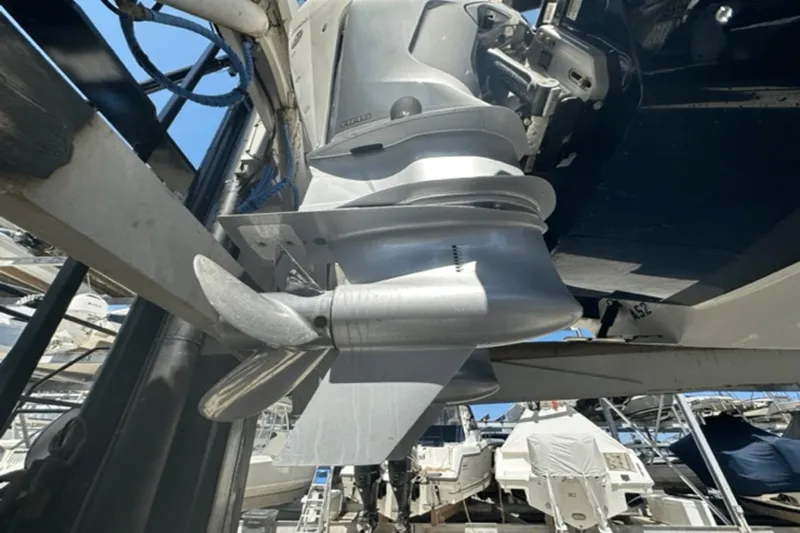  Yacht Photos Pics Close-up of 2022 Aviara AV32 Outboard motor and propeller in a marina.