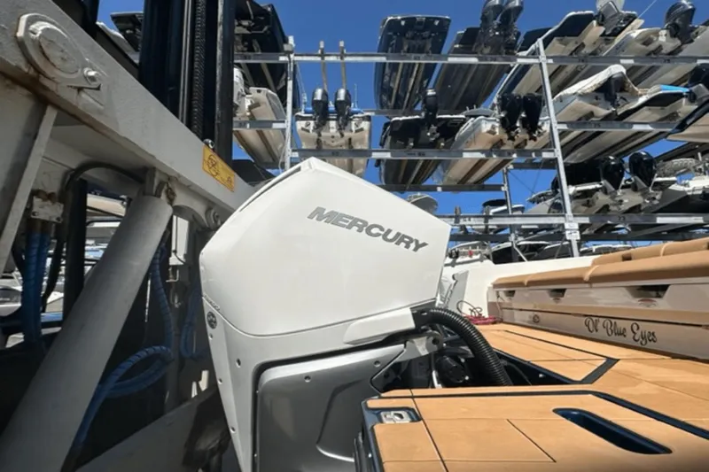  Yacht Photos Pics 2022 Aviara AV32 Outboard with Mercury engine in a boat storage facility.