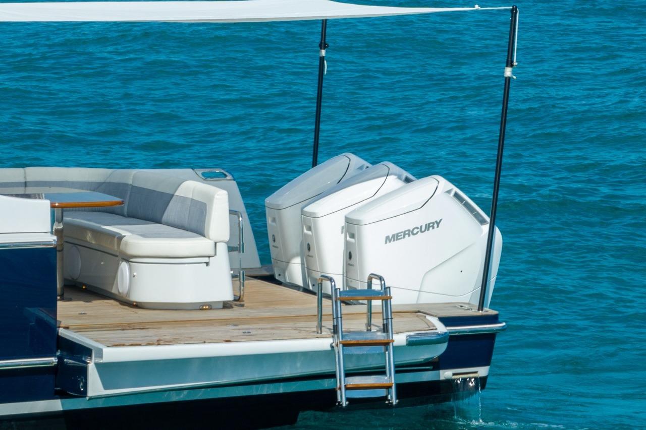 Luxury ECLIPSE 505 Shadow boat with twin Mercury engines, 2026 model, on blue water.