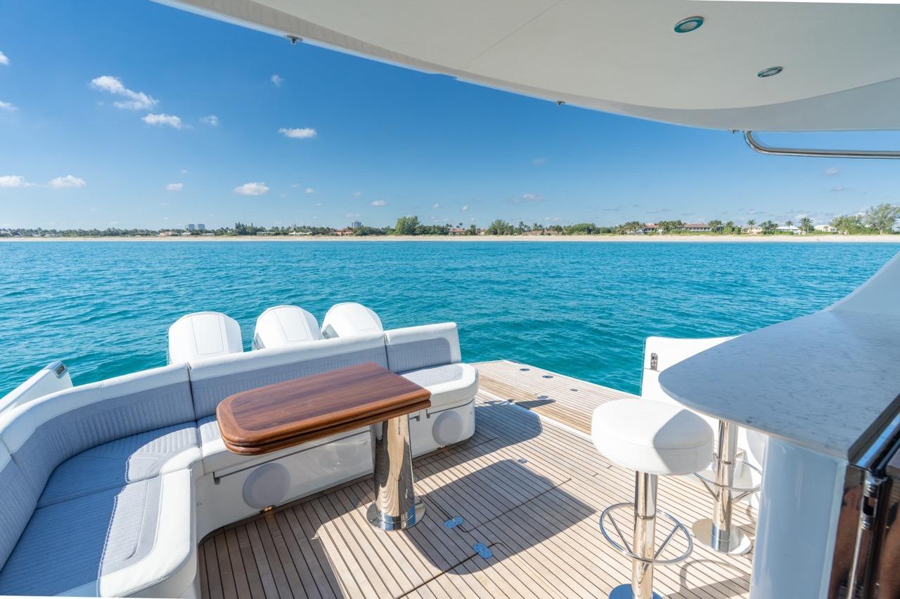 Luxury yacht ECLIPSE 505 Shadow 2026 on serene blue waters, featuring elegant deck seating.