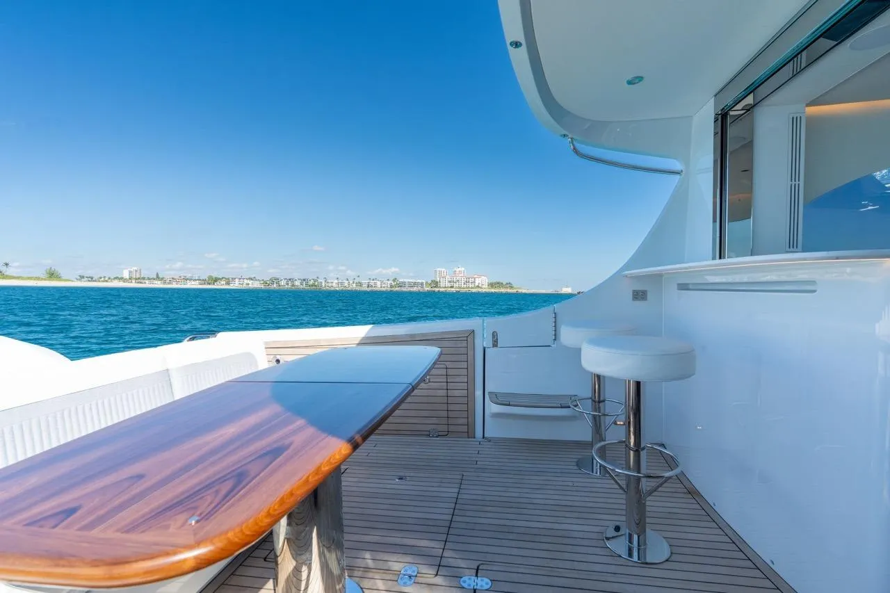 Luxury yacht deck with bar and seating, ECLIPSE 505 Shadow, 2026 model, ocean view.