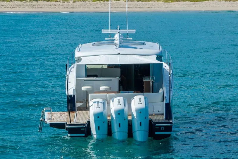 Eclipse 505 Shadow 003 Yacht Photos Pics Luxury ECLIPSE 505 Shadow yacht, 2026 model, with triple outboard engines on clear blue water.