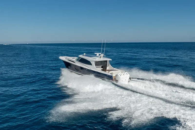 Eclipse 505 Shadow 003 Yacht Photos Pics ECLIPSE 505 Shadow 2026 yacht cruising on open sea under clear blue sky.