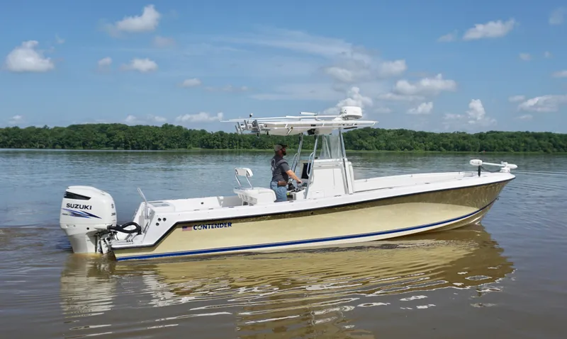  Yacht Photos Pics 2003 Contender 31 Open boat on calm water, featuring Suzuki outboard engine.