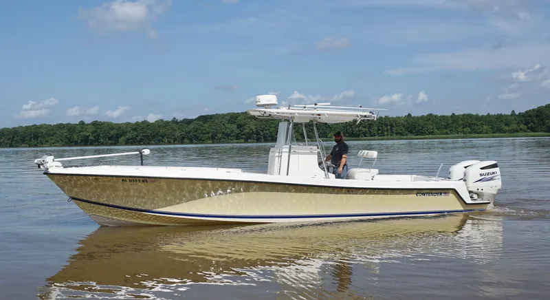  Yacht Photos Pics 2003 Contender 31 Open boat on calm water with Suzuki engines.