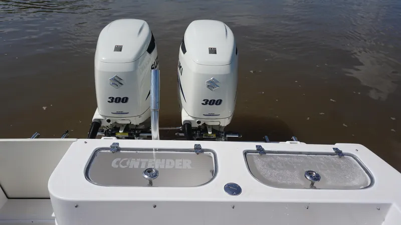  Yacht Photos Pics 2003 Contender 31 Open boat with dual Suzuki 300 outboard engines on water.