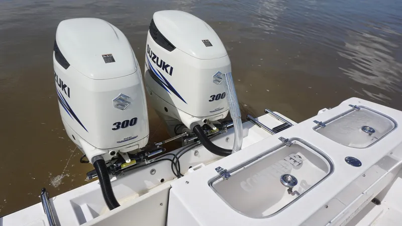  Yacht Photos Pics Twin Suzuki 300 outboard engines on a 2003 Contender 31 Open boat.
