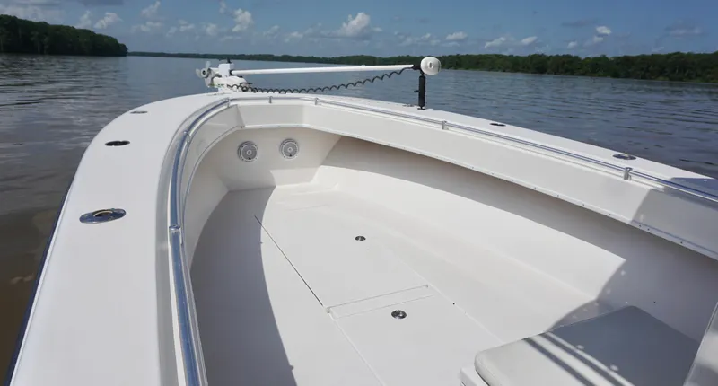  Yacht Photos Pics 2003 Contender 31 Open boat on calm water, showcasing spacious deck and sleek design.