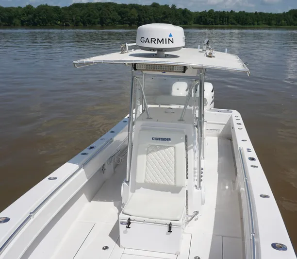 Yacht Photos Pics 2003 Contender 31 Open boat with Garmin radar on calm water.
