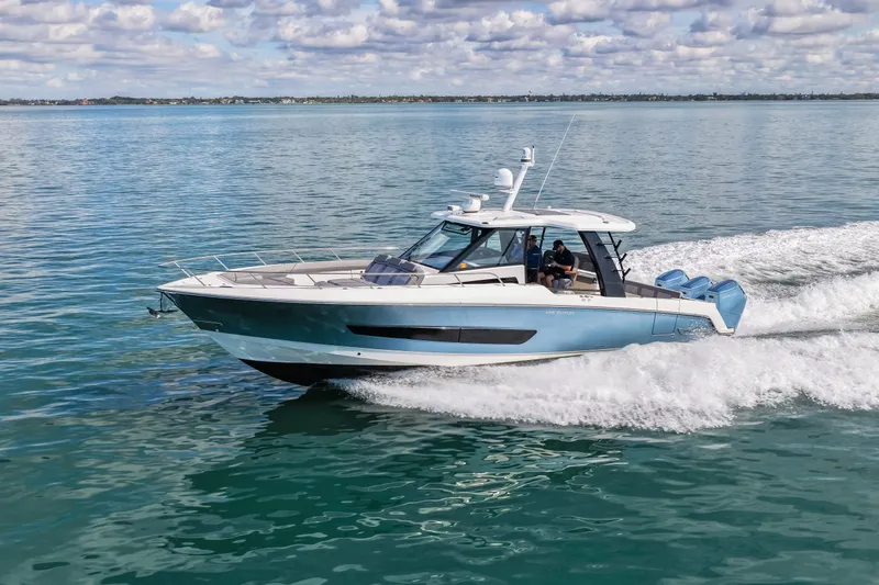  Yacht Photos Pics Boston Whaler 420 Outrage 2023 cruising on calm waters.