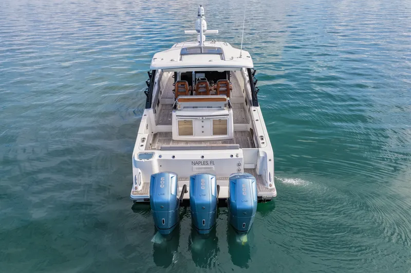  Yacht Photos Pics Boston Whaler 420 Outrage 2023 with four outboard engines on calm water.