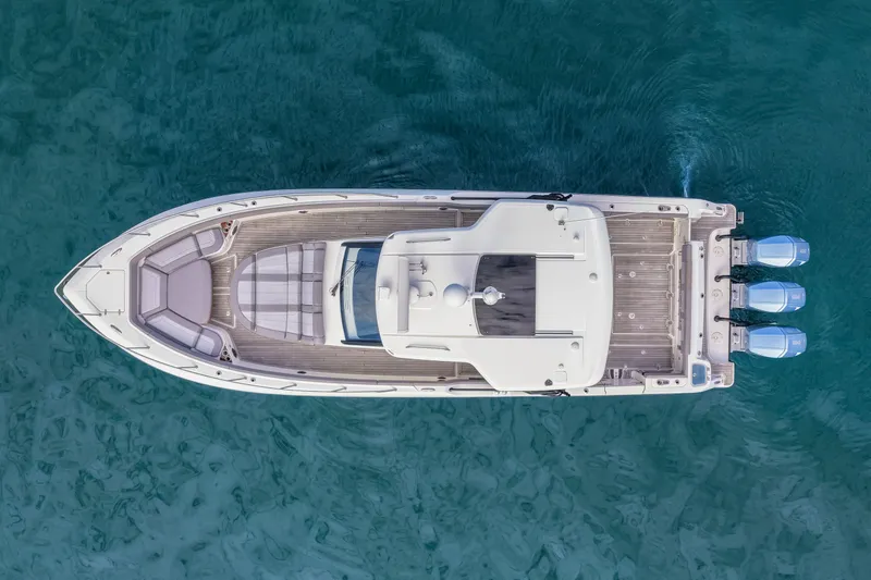  Yacht Photos Pics Aerial view of 2023 Boston Whaler 420 Outrage on blue water.
