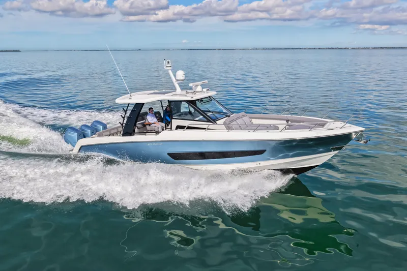  Yacht Photos Pics Boston Whaler 420 Outrage 2023 cruising on calm waters.