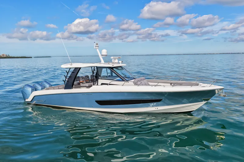 Yacht Photos Pics Boston Whaler 420 Outrage 2023 on calm water under blue sky.