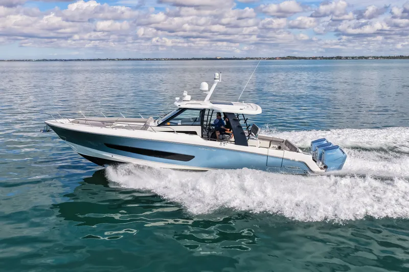  Yacht Photos Pics Boston Whaler 420 Outrage 2023 cruising on calm waters.