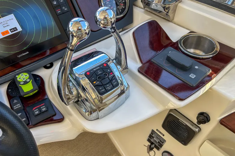  Yacht Photos Pics Control panel of a 2015 Meridian 441 Sedan yacht with navigation and throttle controls.