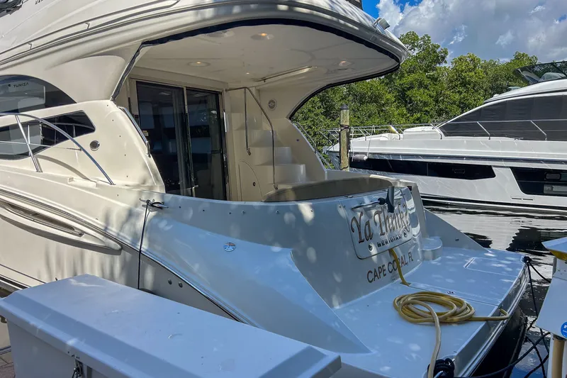  Yacht Photos Pics 2015 Meridian 441 Sedan yacht docked, featuring sleek design and spacious deck area.