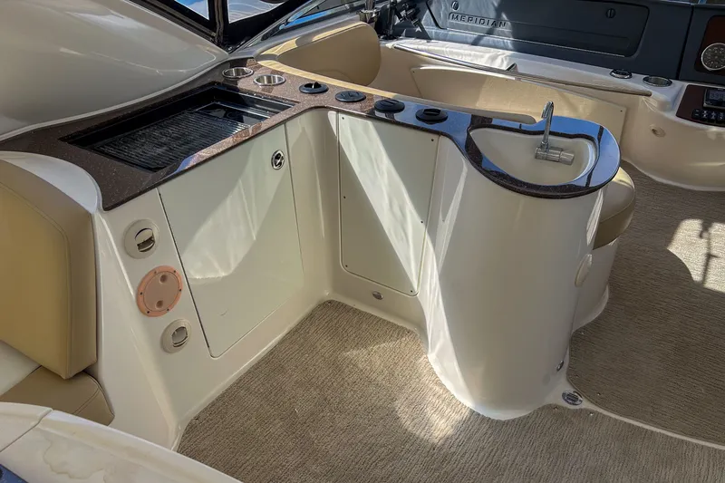  Yacht Photos Pics 2015 Meridian 441 Sedan yacht interior with kitchenette and seating area.