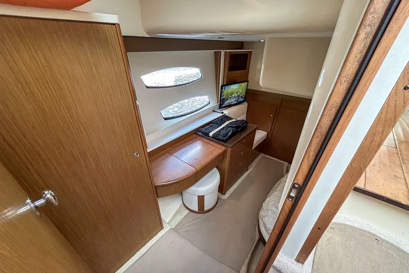  Yacht Photos Pics 2015 Meridian 441 Sedan interior cabin with wooden furnishings and a small desk area.