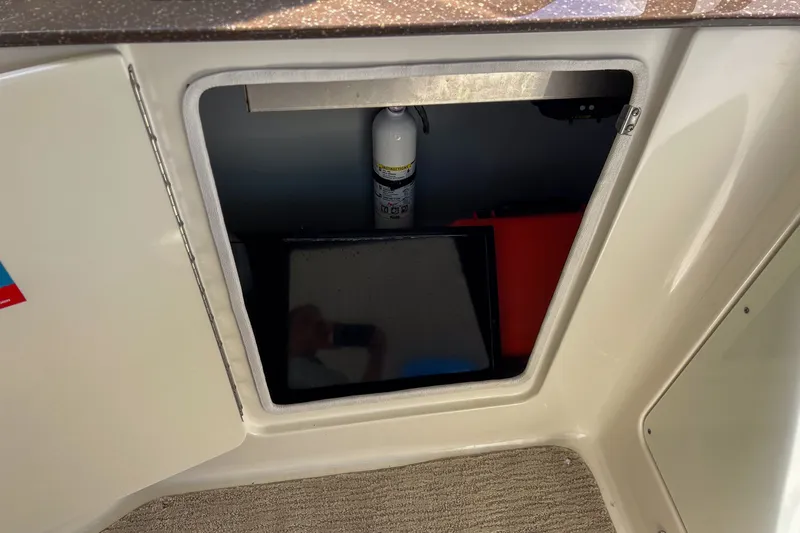  Yacht Photos Pics Open cabinet on 2015 Meridian 441 Sedan with fire extinguisher inside.