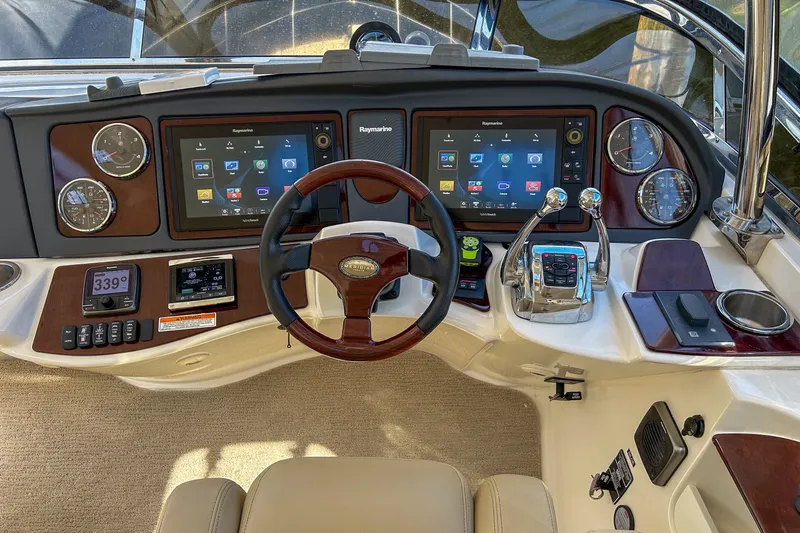  Yacht Photos Pics Cockpit of 2015 Meridian 441 Sedan with advanced navigation displays and controls.