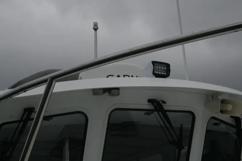 Catcher Yacht Photos Pics 2019 Ocean Sport Roamer 30 boat with overcast sky background.