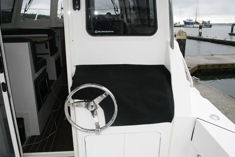 Catcher Yacht Photos Pics 2019 Ocean Sport Roamer 30 #117 boat helm with marina view.
