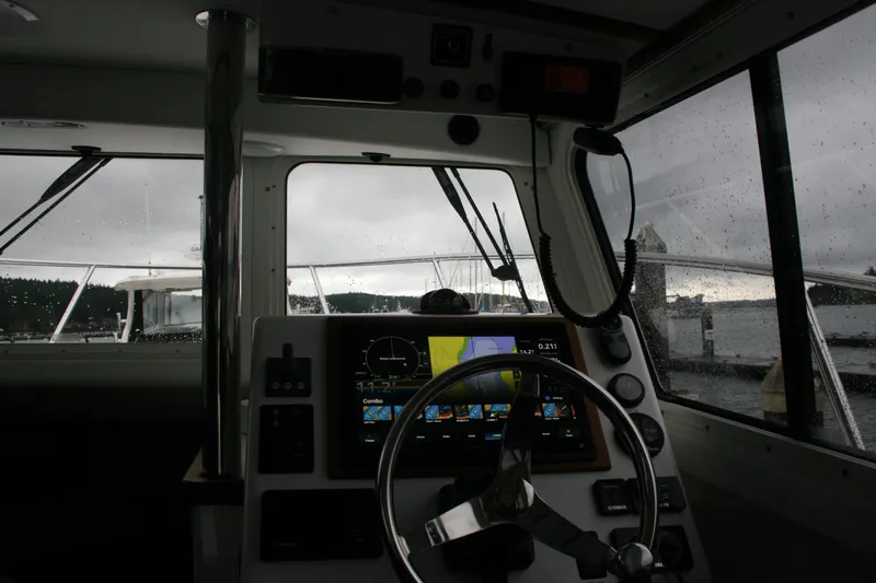 Catcher Yacht Photos Pics Interior view of 2019 Ocean Sport Roamer 30 #117 boat cockpit with navigation system.