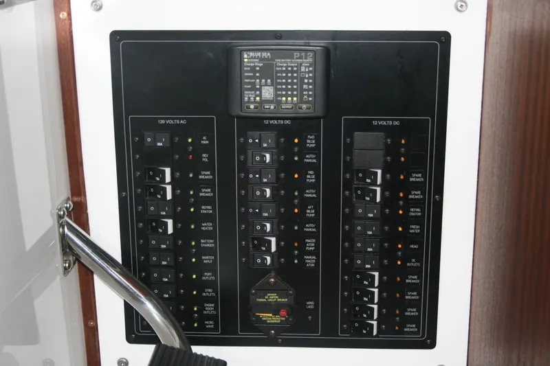 Catcher Yacht Photos Pics Electrical control panel on 2019 Ocean Sport Roamer 30 boat, featuring various switches and indicators.