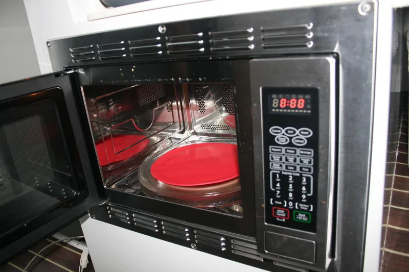 Catcher Yacht Photos Pics Open microwave with digital display and red plate inside, Ocean Sport Roamer 30 #117, 2019.