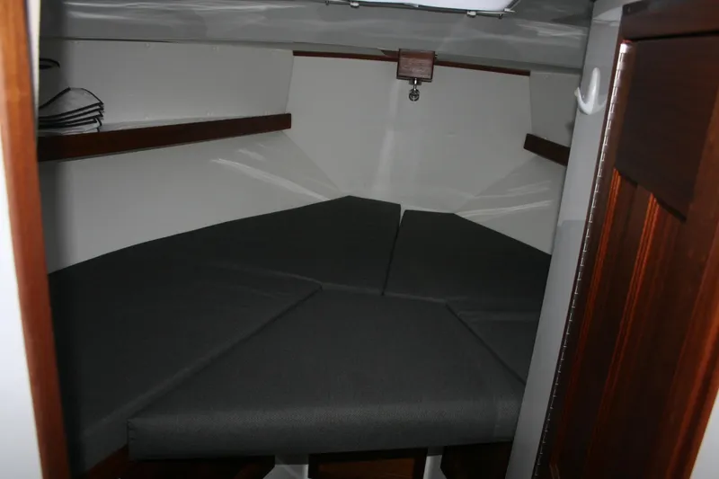 Catcher Yacht Photos Pics 2019 Ocean Sport Roamer 30 #117 cabin interior with gray cushions and wooden accents.