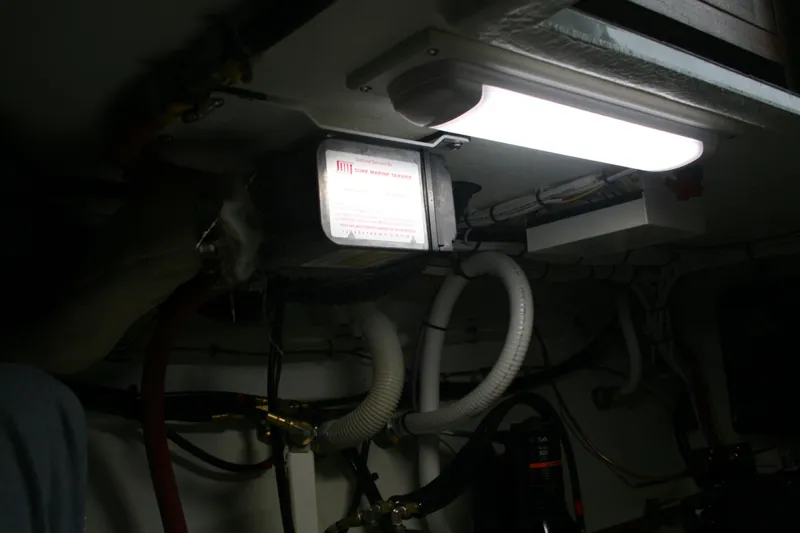 Catcher Yacht Photos Pics Engine room of 2019 Ocean Sport Roamer 30 #117 with illuminated equipment and wiring.