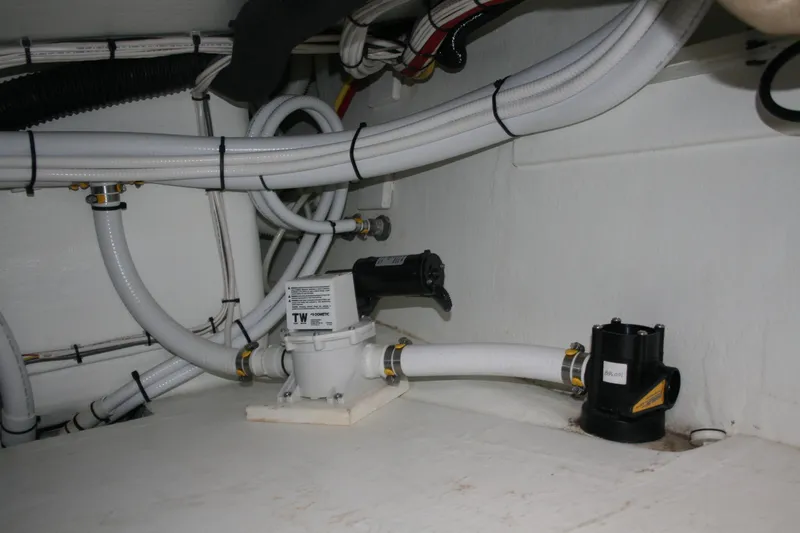 Catcher Yacht Photos Pics Engine room of 2019 Ocean Sport Roamer 30, showcasing plumbing and wiring systems.