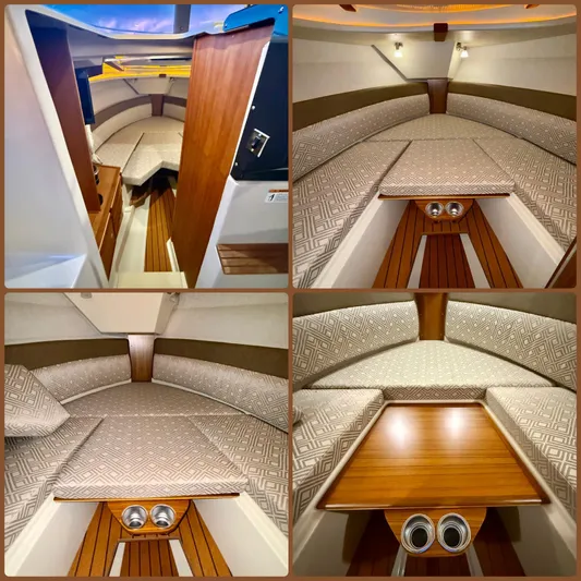  Yacht Photos Pics 2022 Ranger Tugs R-27 interior cabin with cozy seating and wooden accents.