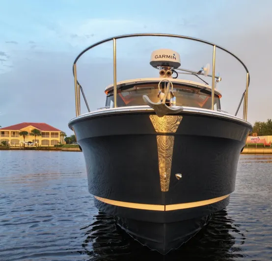  Yacht Photos Pics 2022 Ranger Tugs R-27 boat on water, front view with Garmin equipment.
