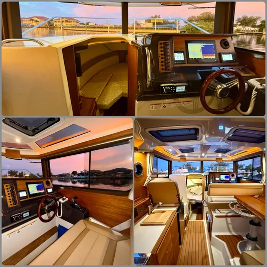  Yacht Photos Pics 2022 Ranger Tugs R-27 interior showcasing helm, seating, and cabin with modern amenities.