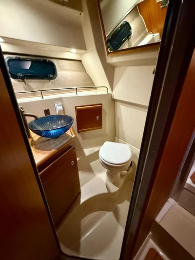  Yacht Photos Pics 2022 Ranger Tugs R-27 boat bathroom with modern sink and toilet.