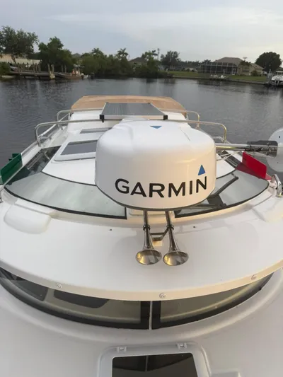  Yacht Photos Pics 2022 Ranger Tugs R-27 boat with Garmin radar on a calm waterway.