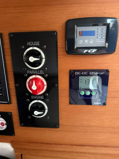  Yacht Photos Pics Control panel of a 2022 Ranger Tugs R-27 boat with battery switches and DC-DC charger.