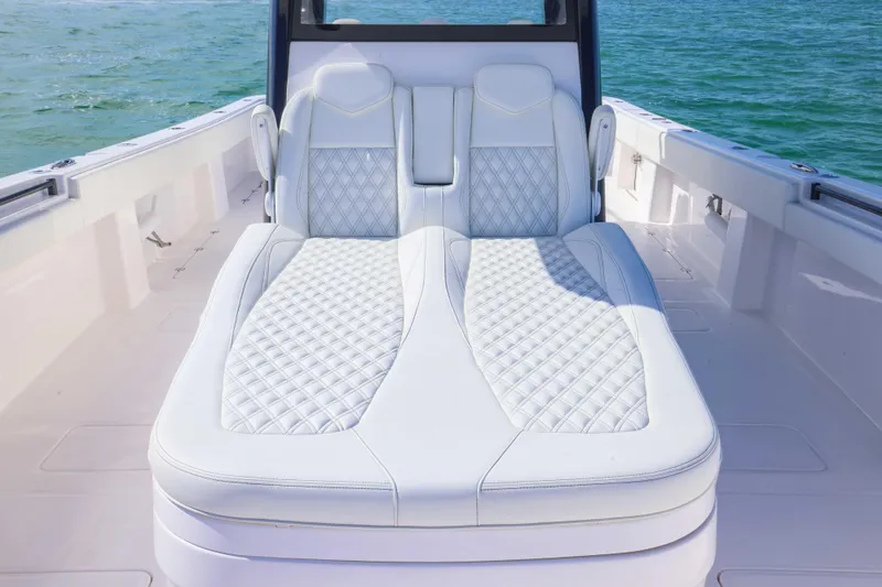  Yacht Photos Pics Luxurious seating on 2025 Invincible 35 Catamaran, featuring elegant white upholstery.
