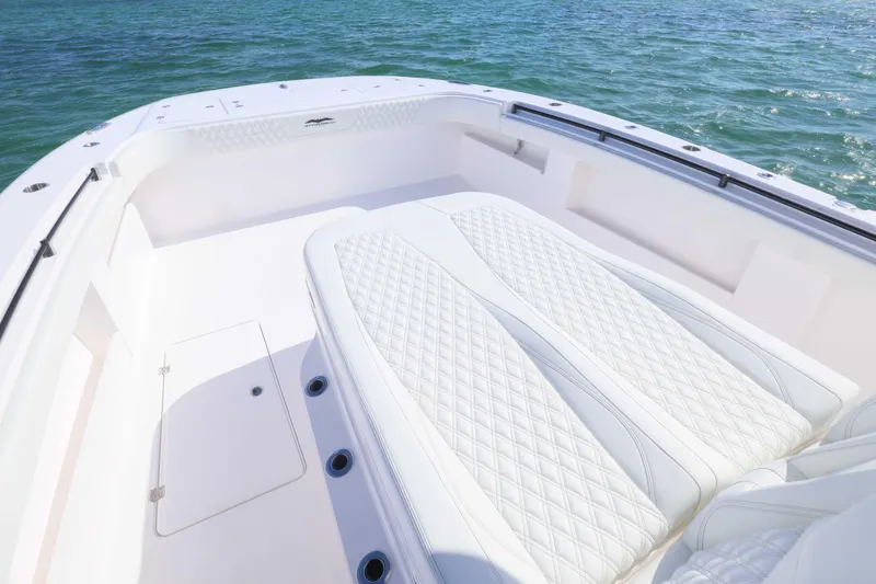  Yacht Photos Pics 2025 Invincible 35 Catamaran with luxurious white seating on open water.